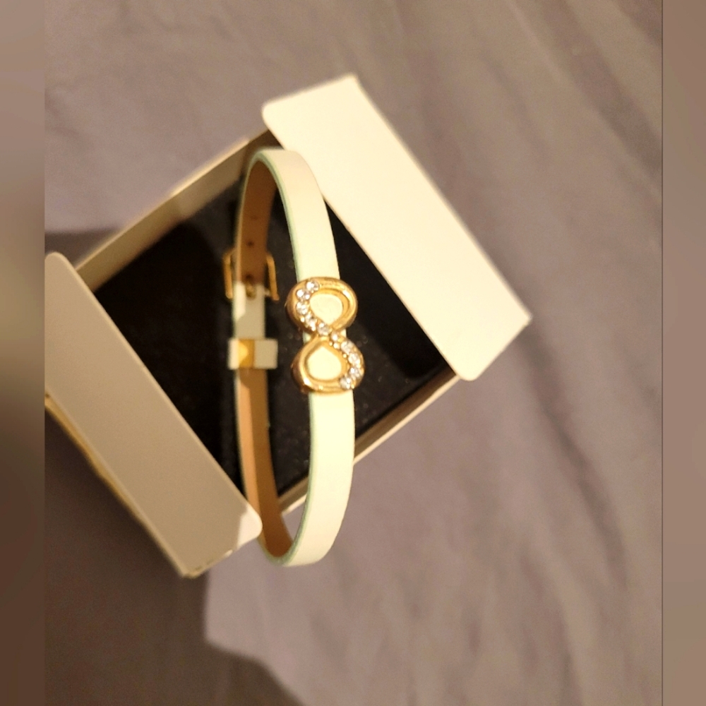 Lia Sophia 8" eternity bracelet with white sets. Light green band.  Never worn.